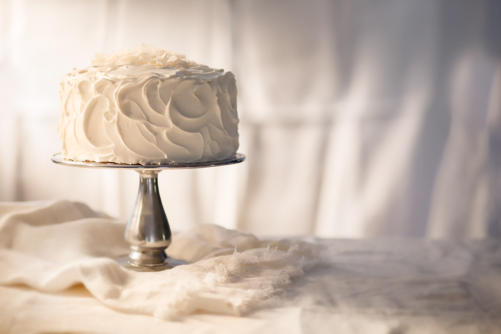 White Cake on Pedestal Food Beverage Photography- © Aristo Studios
